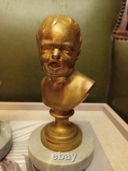 Child’s Bust. Gilt Bronze on Marble. France. 19th/20th Century