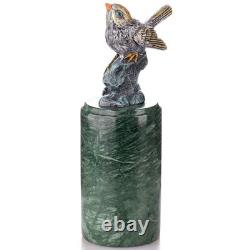 Colored bronze bird sculpture on a marble base after Milo