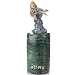 Colored bronze bird sculpture on a marble base after Milo