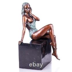 Colored bronze figure of a nude female on a black marble Signed