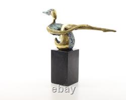 Colored sculpture of a woman in bronze on a black marble base after Nick