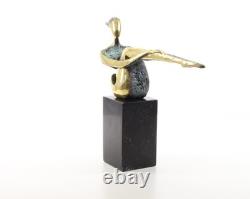 Colored sculpture of a woman in bronze on a black marble base after Nick