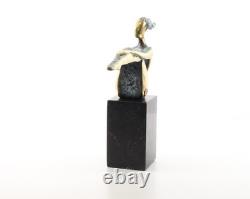 Colored sculpture of a woman in bronze on a black marble base after Nick