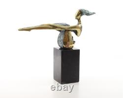 Colored sculpture of a woman in bronze on a black marble base after Nick