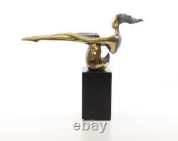 Colored sculpture of a woman in bronze on a black marble base after Nick