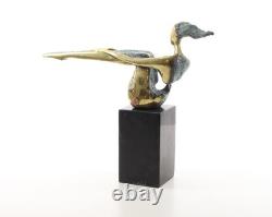 Colored sculpture of a woman in bronze on a black marble base after Nick