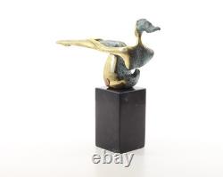 Colored sculpture of a woman in bronze on a black marble base after Nick