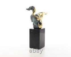 Colored sculpture of a woman in bronze on a black marble base after Nick