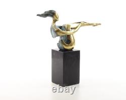 Colored sculpture of a woman in bronze on a black marble base after Nick