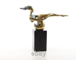 Colored sculpture of a woman in bronze on a black marble base after Nick