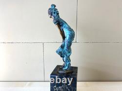 Colorful bronze female sculpture on a black marble base after Milo