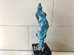 Colorful bronze female sculpture on a black marble base after Milo