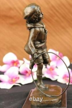 D. H Chiparus Statue of Boy with Loop Made of Bronze on a Marble Base Signed