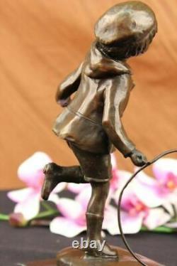 D. H Chiparus Statue of Boy with Loop Made of Bronze on a Marble Base Signed