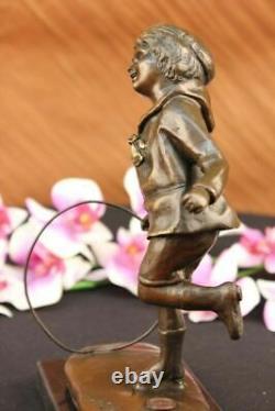 D. H Chiparus Statue of Boy with Loop Made of Bronze on a Marble Base Signed