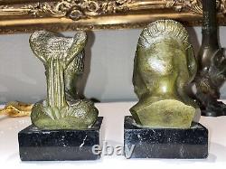 GARREAU (born in 1885) Pair of Art Deco bronze bookends on marble Signed