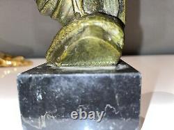 GARREAU (born in 1885) Pair of Art Deco bronze bookends on marble Signed