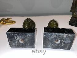 GARREAU (born in 1885) Pair of Art Deco bronze bookends on marble Signed