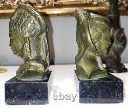 GARREAU (born in 1885) Pair of Art Deco bronze bookends on marble Signed