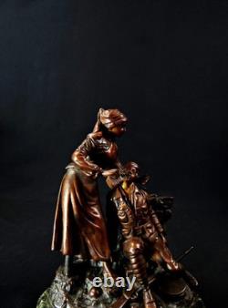 Georges Omerth bronze sculpture on marble of a nurse caring for a soldier