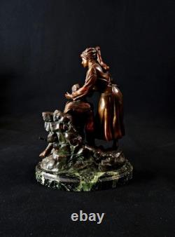 Georges Omerth bronze sculpture on marble of a nurse caring for a soldier
