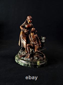 Georges Omerth bronze sculpture on marble of a nurse caring for a soldier