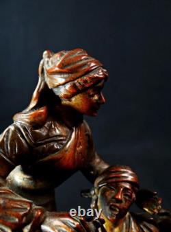 Georges Omerth bronze sculpture on marble of a nurse caring for a soldier