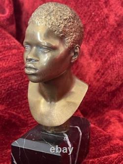 Golden bronze bust sculpture portrait of an African man signed and numbered on marble base