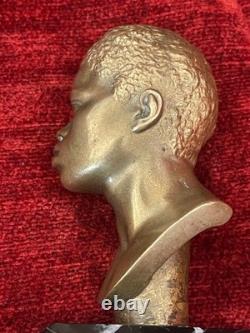 Golden bronze bust sculpture portrait of an African man signed and numbered on marble base