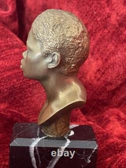 Golden bronze bust sculpture portrait of an African man signed and numbered on marble base