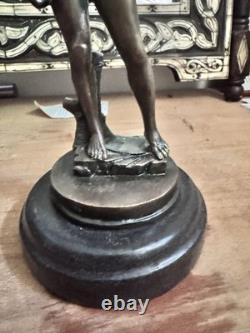 Michelangelo bronze statue of a nude man, signed, on a marble base, 20th century