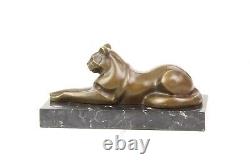 Modern Bronze Sculpture of a Cat Leaning on Black Marble