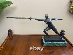 Modern bronze sculpture of a fencer on a green marble base after Nick