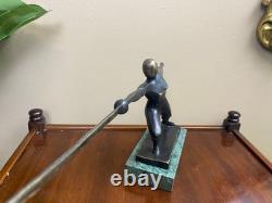 Modern bronze sculpture of a fencer on a green marble base after Nick