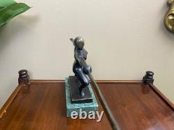 Modern bronze sculpture of a fencer on a green marble base after Nick