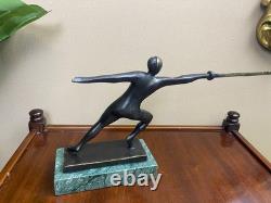 Modern bronze sculpture of a fencer on a green marble base after Nick