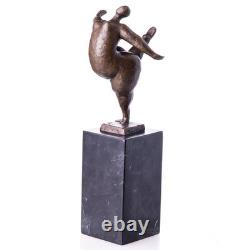 Modern bronze sculpture of a naked woman on black marble after Milo