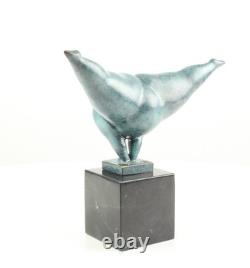 Modern bronze sculpture of a naked woman on black marble after Milo