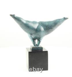 Modern bronze sculpture of a naked woman on black marble after Milo