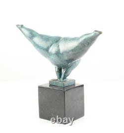 Modern bronze sculpture of a naked woman on black marble after Milo