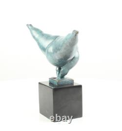 Modern bronze sculpture of a naked woman on black marble after Milo