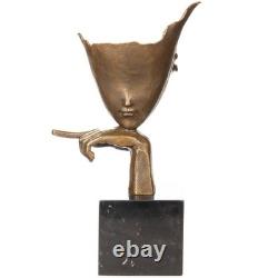 Modern bronze sculpture with abstract face on black marble signed