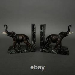 Pair of bronze elephant bookends signed Carvin with marble bases M3300