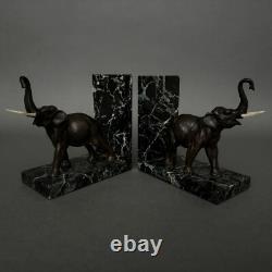 Pair of bronze elephant bookends signed Carvin with marble bases M3300
