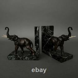 Pair of bronze elephant bookends signed Carvin with marble bases M3300