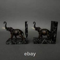 Pair of bronze elephant bookends signed Carvin with marble bases M3300