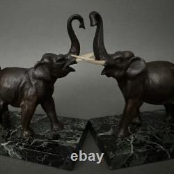 Pair of bronze elephant bookends signed Carvin with marble bases M3300