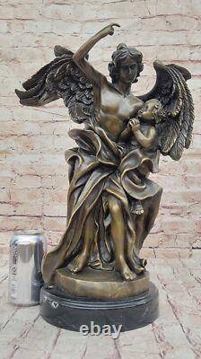 Sculpture Statue in Marbled Bronze of a Large Muscular Angel Signed with a Child