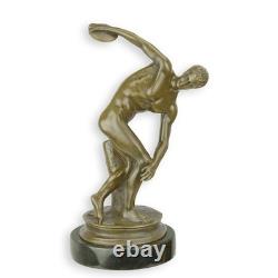 Sculpture of Discobolus by Myron in bronze on a black marble after Myron