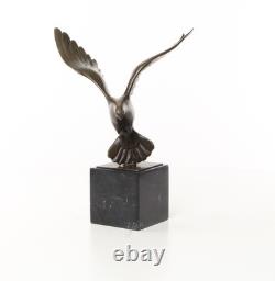 Sculpture of a Flying Pigeon on a Black Marble Base after Ceonard